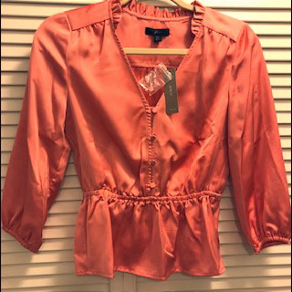 Lovely tangerine top.  Dress up or down